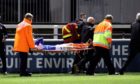 Ross Clarke is stretchered off during Elgin City v Cowdenbeath.