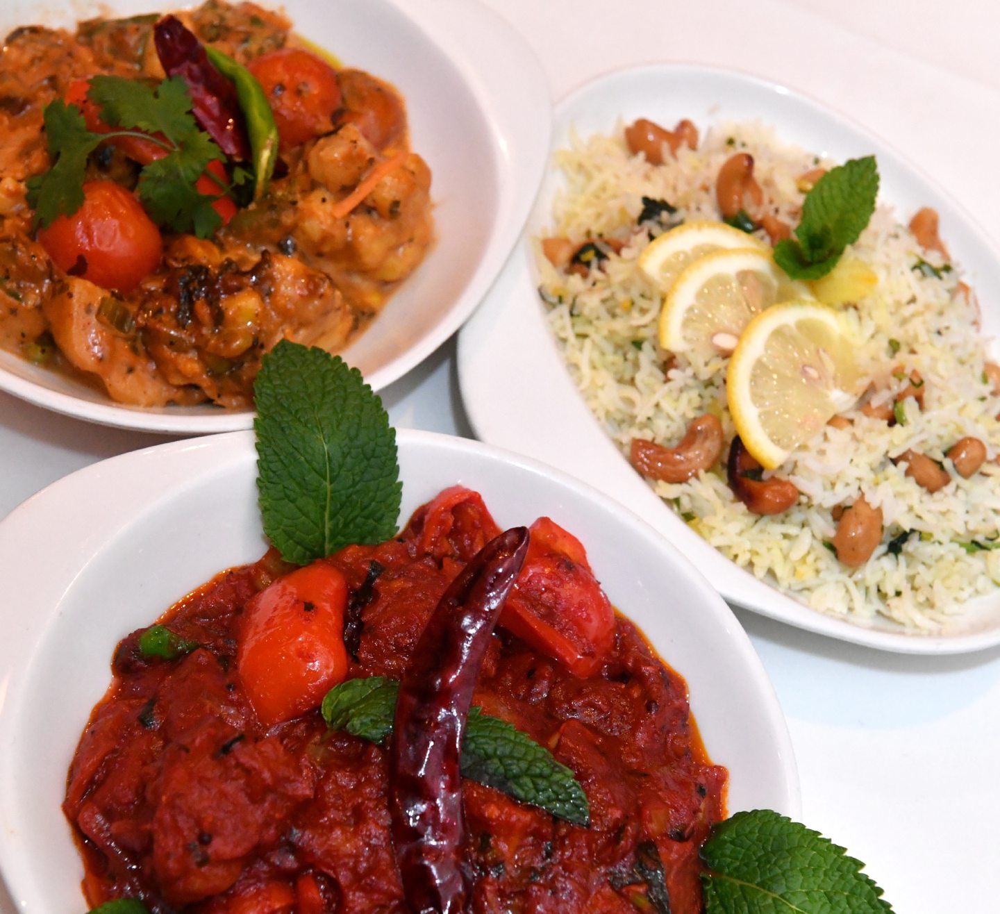 South Indian vegetarian curry, Lamb naga zhal and lemon and cashew rice dishes