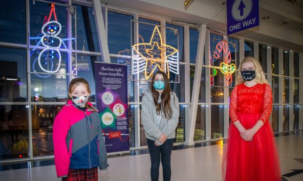 School pupils (L-R) Elli MacLean, Amy Fox and Kayleigh Paton.