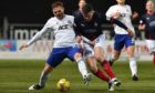 Fraser Fyvie (Cove Rangers) tussles with Anton Dowds (Falkirk) during the Scottish League 1 match.