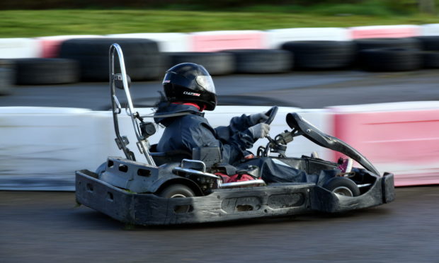 Gayle whizzes round the track at Lochter in a go kart.