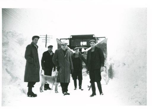 An image of men and a dog battling snow in Tomintoul has been included in the archive.