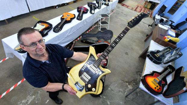 Auctioneer Dave Smith will be auctioning later this month.
Dave is pictured with some of the guitars that are in the auction. 
Pic by Chris Sumner
Taken 06/11/20