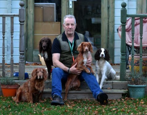 Robert Riggs pictured with his dogs, Angus, Duchess, Midge and Jez.