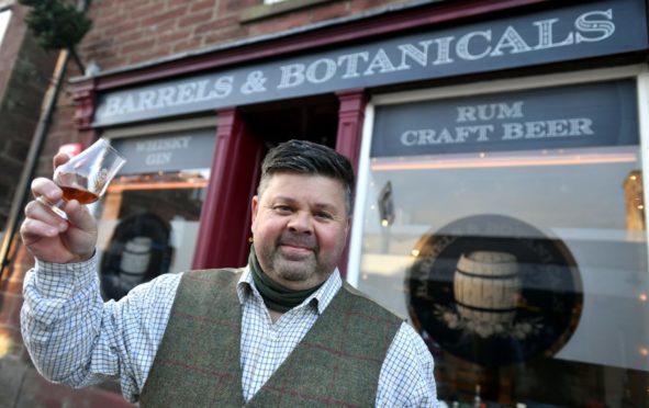 Mark Stephen, raises a toast to his new shop, Barrels and Botanicals in Main Street Turriff.