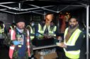 Pictured are from left Justin Ritchie, founder of Street Friends and Sumon Hoque of Aberdeen Muslims at the relaunch of their partnership foodbox campaign giving out hot curries. 
Pictured by Darrell Benns