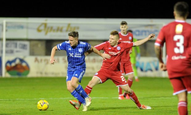 Peterhead midfielder Simon Ferry, left