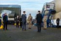 Moray military representatives paying their respects to the two pilots.