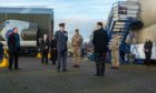 Moray military representatives paying their respects to the two pilots.