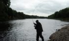 An angler on the River Spey near Craigellachie.