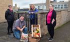 Daphne Thomas, volunteer for delivering meals and chairwoman of the Senior Citizen Christmas party, Neil Cameron, chairman of Lossie 2 to 3 group, Lossiemouth community councillor Carolle Ralph and Louise McBride, manager of the Lossie 2 to 3 Group