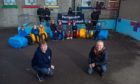 Portgordon Primary head teacher Karen Murray and Kenny Gunn (Chairman of Portgordon Fireworks Group) with the new outdoor seating.