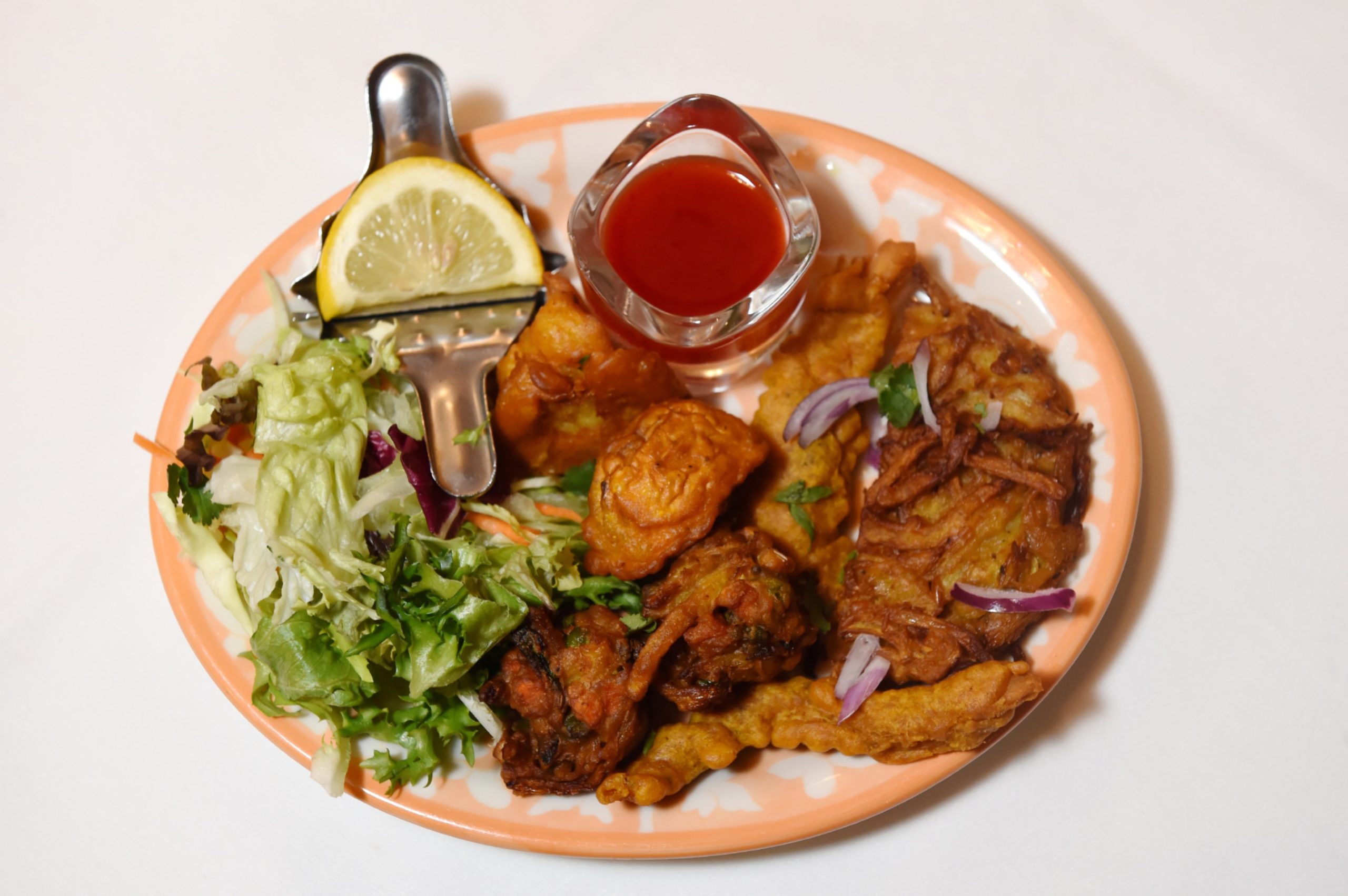 A dish of pakora and salad in the Nurtaj Indian restaurant in Aberdeen