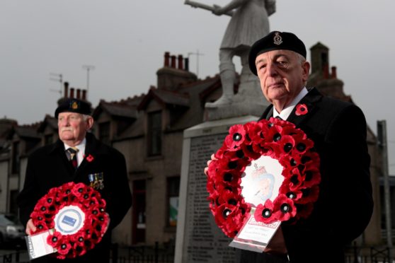 Branch president David Taylor,left, and chairman Douglas Watson, laying a wreath at Ellon's war memorial earlier this month.
Picture by Scott Baxter
