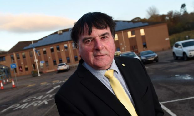 Highland Councillor Ken Gowans outside Culloden Academy.