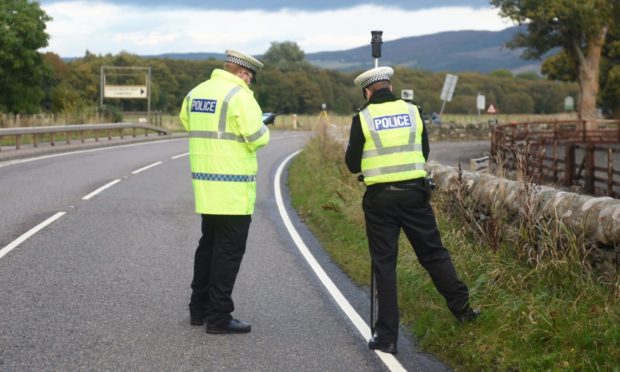 Police at the scene of an accident on the A82