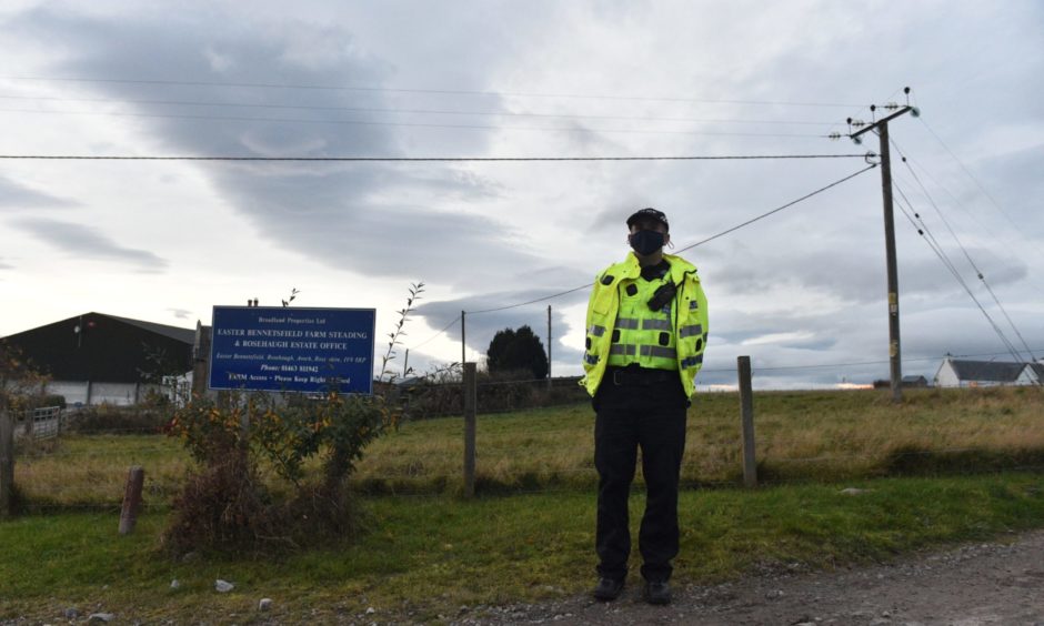 Police near the scene of the helicopter crash at Avoch.