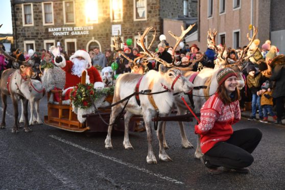 A previous Santa and reindeer parade through Banff.