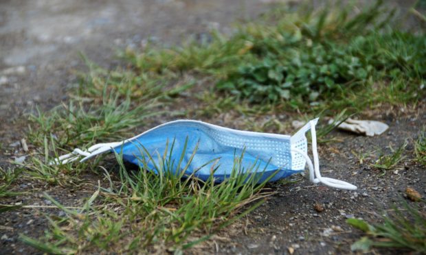 To go with story by Calum Petrie. The James Hutton Institute is responding to concerns over the ecological impact of Covid-19 by developing environmentally-friendly PPE. Picture shows; Discarded face mask. Aberdeen. Supplied by James Hutton Institute Date; Unknown