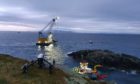 The recovery operation of the sunken fish farm vessel Tiffany of Melfort at Shiant Isles.