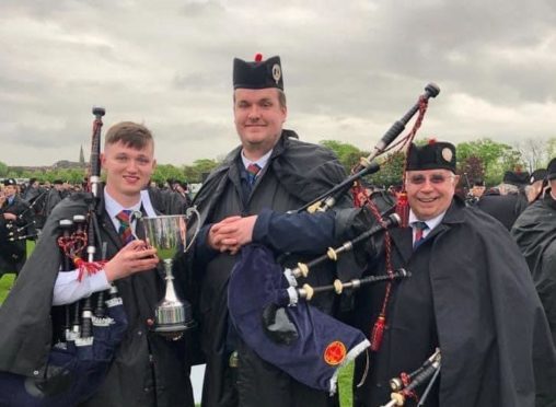 Turriff Pipe Band pipe sergeant Owen Chalmers, pipe major Andrew Gray and the late John Lawson.