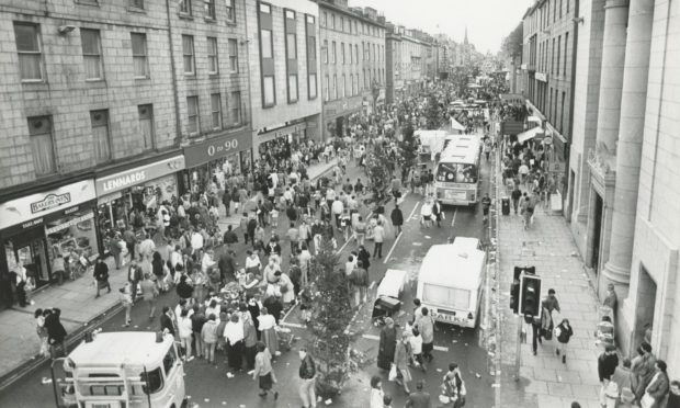 Out in force...Aberdeen's Union Street is packed with people for the last shopping Sunday before Christmas in 1987.
