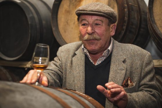 Whisky writer Charles Maclean sampling the Deeside Distillery spirit that will be auctioned off to raise cash for the River Dee Trust. Supplied by River Dee Trust.