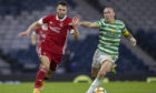 Aberdeen's Conor McLennan (left) tries to get away from Scott Brown of Celtic.