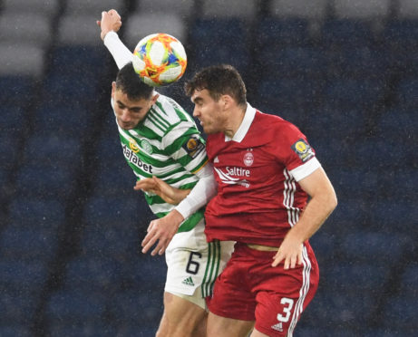 Tommie Hoban, right, competes with Celtic's Nir Bitton for a header in the 2019/20 Scottish Cup semi-final at Hampden.
