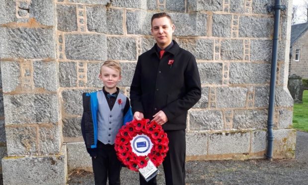 Councillor Robbie Withey and his son Shea at last year's Remembrance Sunday event in Tullynessle.