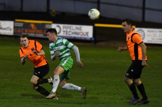 Rothes midfielder Fraser Robertson, left, in action against Buckie during the Highland League Cup final