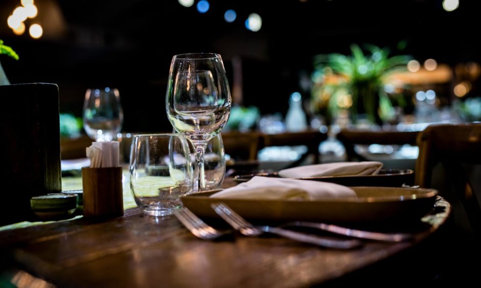 A restaurant table set up, ready for diners