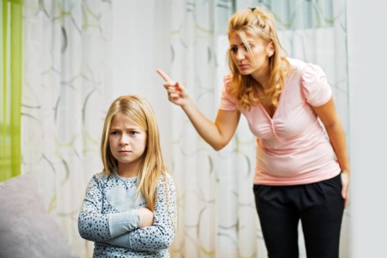 Picture shows a mother and daughter having quarrel at home.