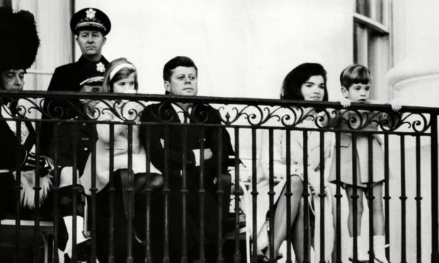 President Kennedy and his family enjoy The Black Watch performance.