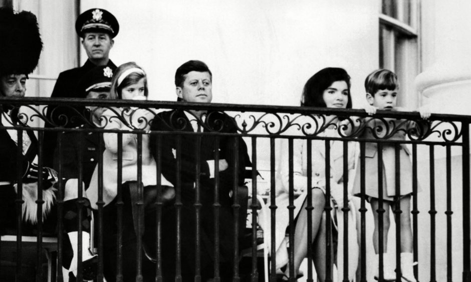 President Kennedy and his family enjoy The Black Watch performance.