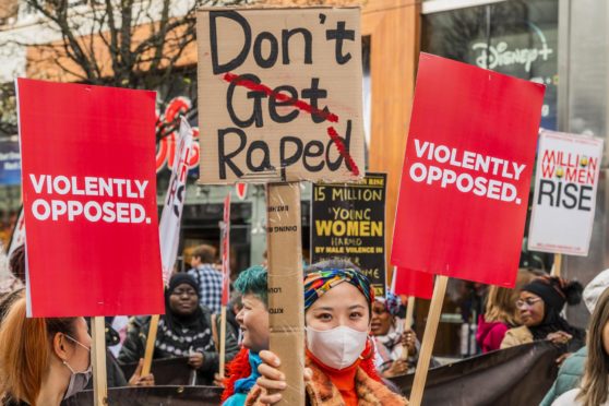 Million Women Rise March, London 2020. Marchers were asked to wear something red - the colour of blood, 'the blood of our sisters who have been murdered and raped at the hands of male violence'. Photo by Guy Bell/Shutterstock