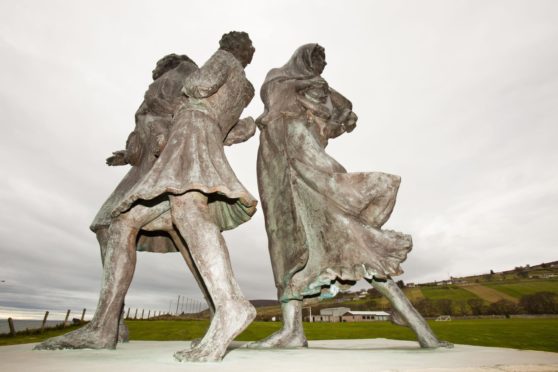 The Emigrants Statue in Helmsdale commemorates the flight of Highlanders during the highland clearances, and celebrates their accomplishments in the places they settled (Photo by Global Warming Images/Shutterstock)