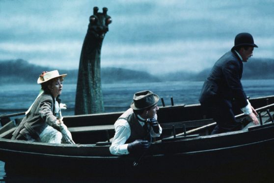 Genevieve Page, Robert Stephens and Colin Blakely in a scene from the movie.