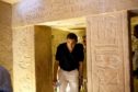 US President Barack Obama ducks his head to get through an entranceway on a tour of the Pyramids and Sphinx in Egypt. On the centre-right of the picture is the hieroglyphic that the President commented on saying it looked like him. Photo by Shutterstock, June 2009