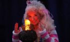 Perth Theatre. Dress rehearsal for Aladdin. Pictured, 'Princess Pikaboo' , played by Katy Wale, looked to be keeping warm during this cold spell, pictured here with a stage prop lantern.