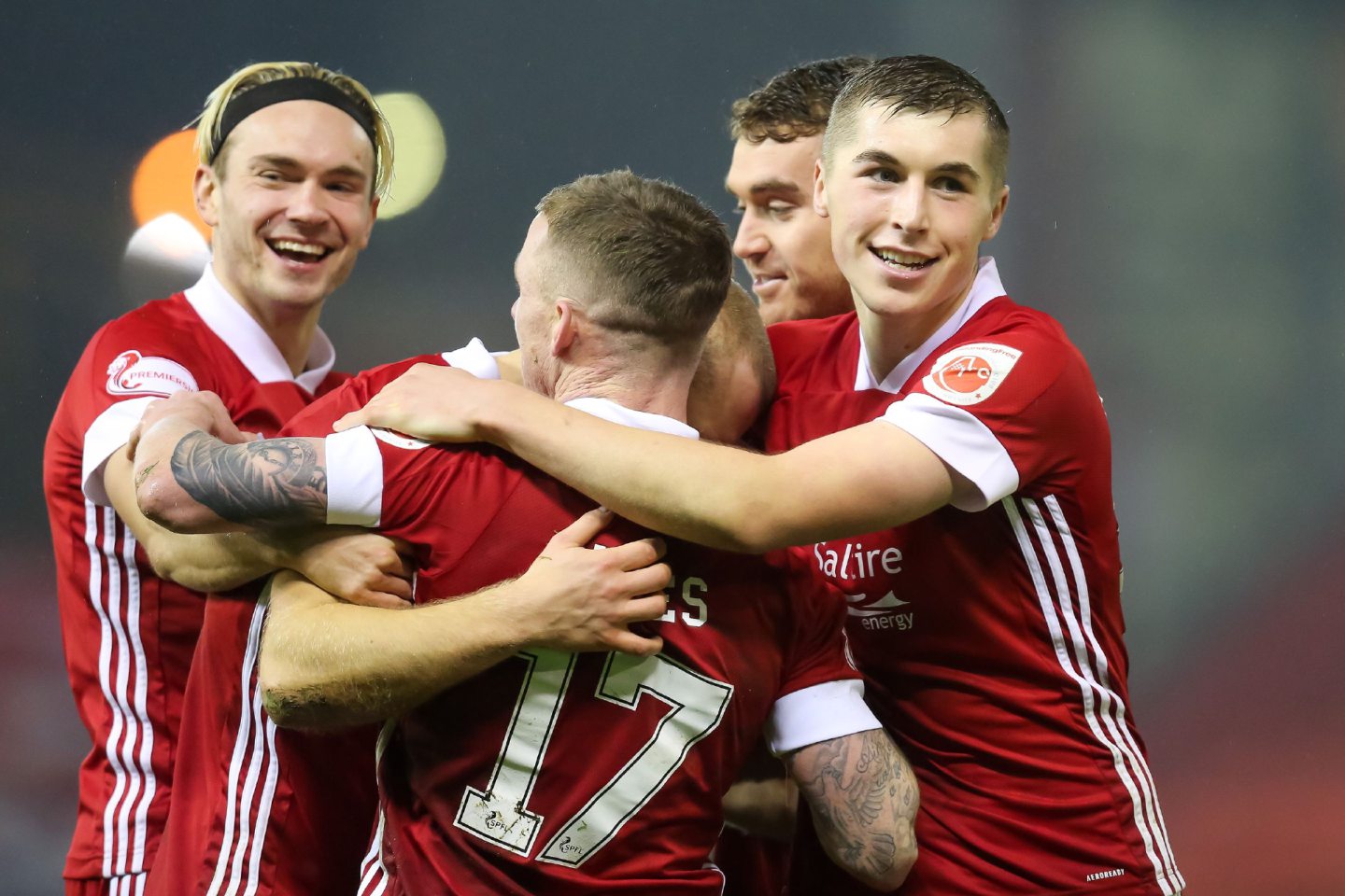 Aberdeen forward Curtis Main (9) celebrates his goal to make it 2-0 against Ross County with Ryan Hedges (11) and Dean Campbell (24).