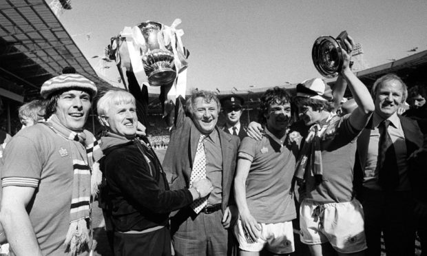 Tommy Docherty, seen here winning the FA Cup in May 1977.