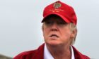 Donald Trump on  the Trump International Golf Links golf course near Aberdeen. Image by PA