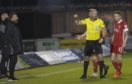 Referee Bobby Madden shows Aberdeen manager Derek McInnes a yellow card and Jonathan Hayes looks frustrated during the Scottish Premiership match between St Mirren and Aberdeen.