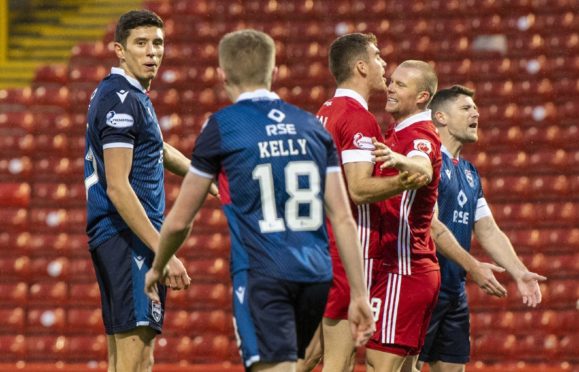 Curtis Main celebrates his opening goal for Aberdeen against Ross County with Tommie Hoban.