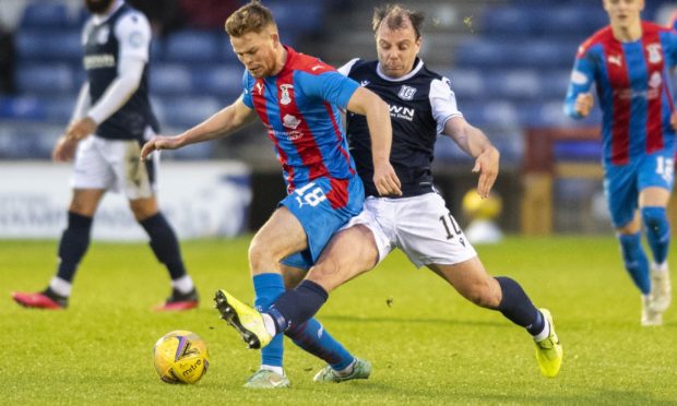 Inverness' Scott Allardice (left) holds off Dundee's Paul McGowan during a Scottish Championship match.