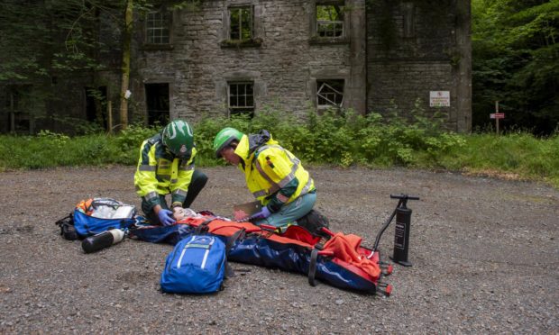 Sandpiper Trust volunteers offering emergency medical treatment to a patient