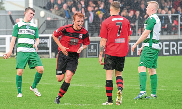 Martin Laing celebrates a goal for Locos in 2017.