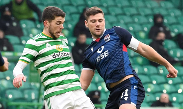 Iain Vigurs, right, battles with Ryan Christie.