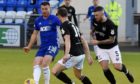Cove Rangers striker Rory McAllister in action against Montrose.
